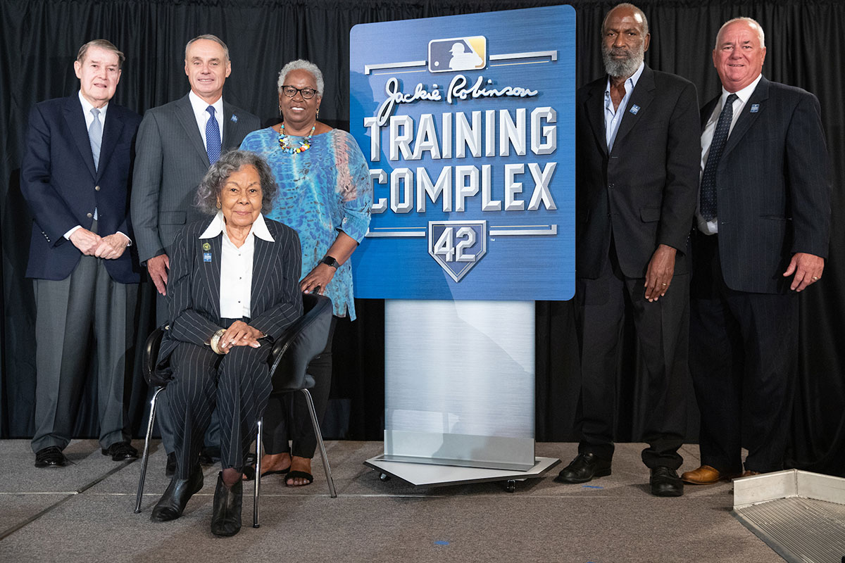 Rachel Robinson (seated), widow of Major League Baseball great Jackie Robinson, daughter Sharon Robinson (behind her) and son David Robinson (second from right) gathered with MLB and local officials to announce Historic Dodgertown’s renaming on April 2, 2019. Peter O’Malley, former Dodger owner, is on the left.