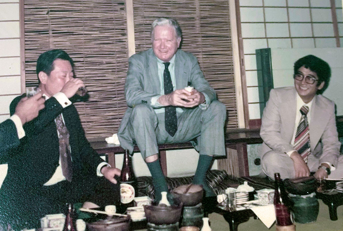 Egan at dinner with Japanese customers, likely in the 1980s