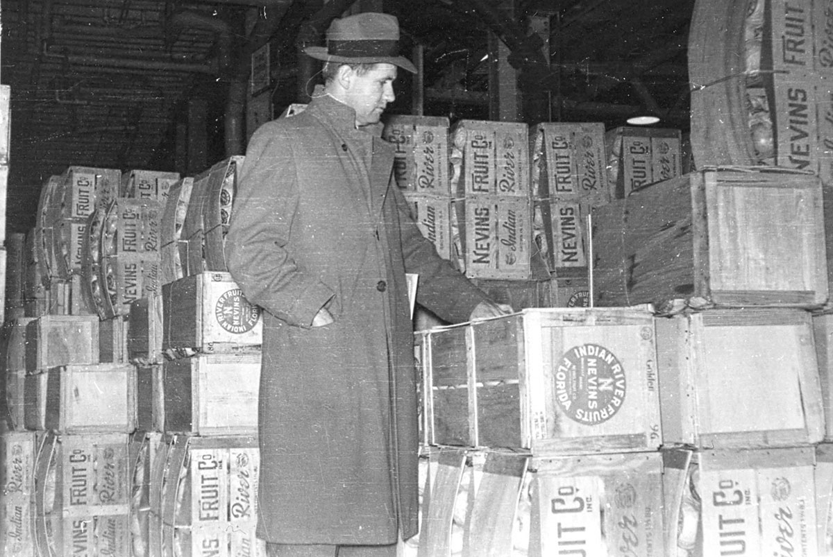 Egan, then general manager of the family’s company, with cartons of Florida citrus in the 1940s in New York City.