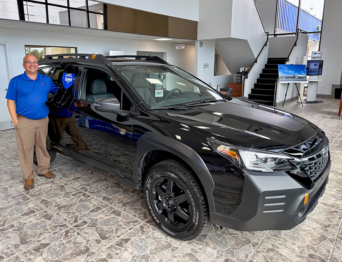 Dyer Subaru sales manager Brandon Reynolds with the 2023 Outback