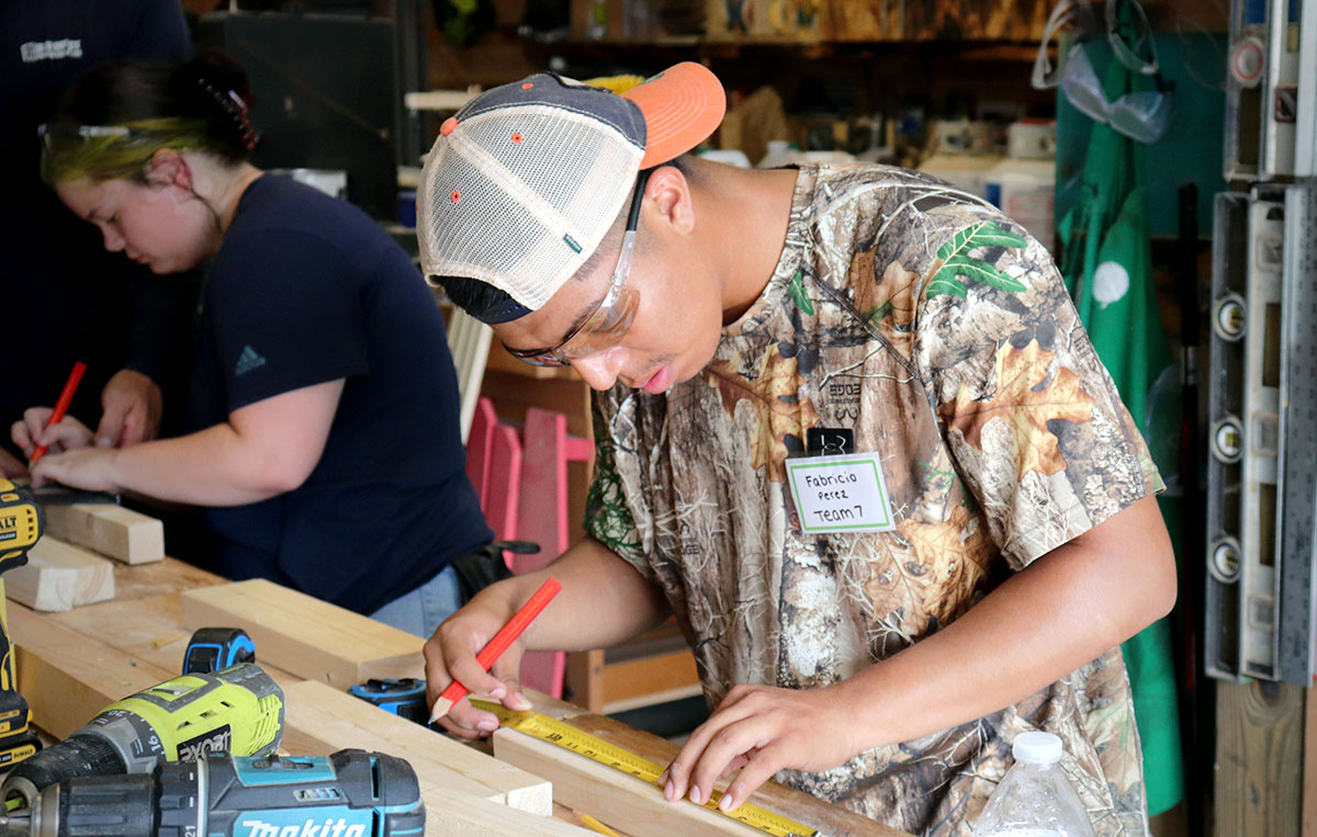 Fabricio Perez and Kyli Carroll learn carpentry skills