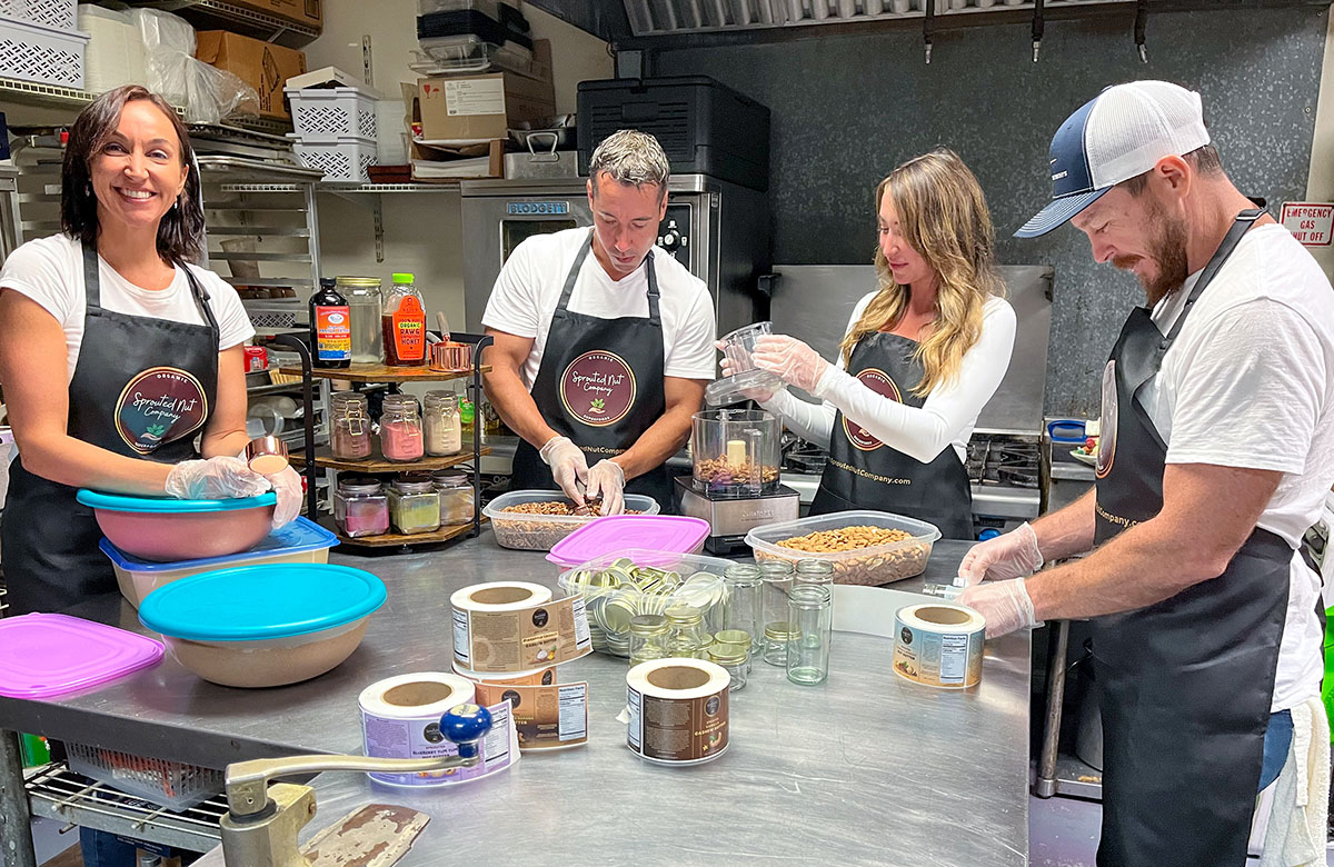 It is all hands on deck, and very much a family affair, as Sprouted Nut Company founder Smith works with, from left, her brother, A.J. Smith; her sister, Sara Smith; and Sara’s boyfriend, Tim Losdon, on the production of Sprouted Nut Company products in the kitchen of Ooo La La Catering in Stuart.