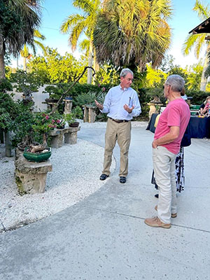 Curator Tom Kehoe explains bonsai to visitors-300